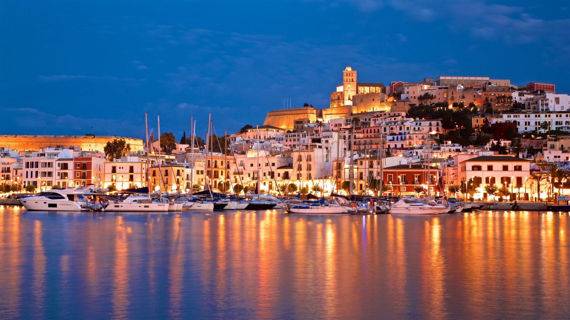 Ibiza town and harbor at dusk